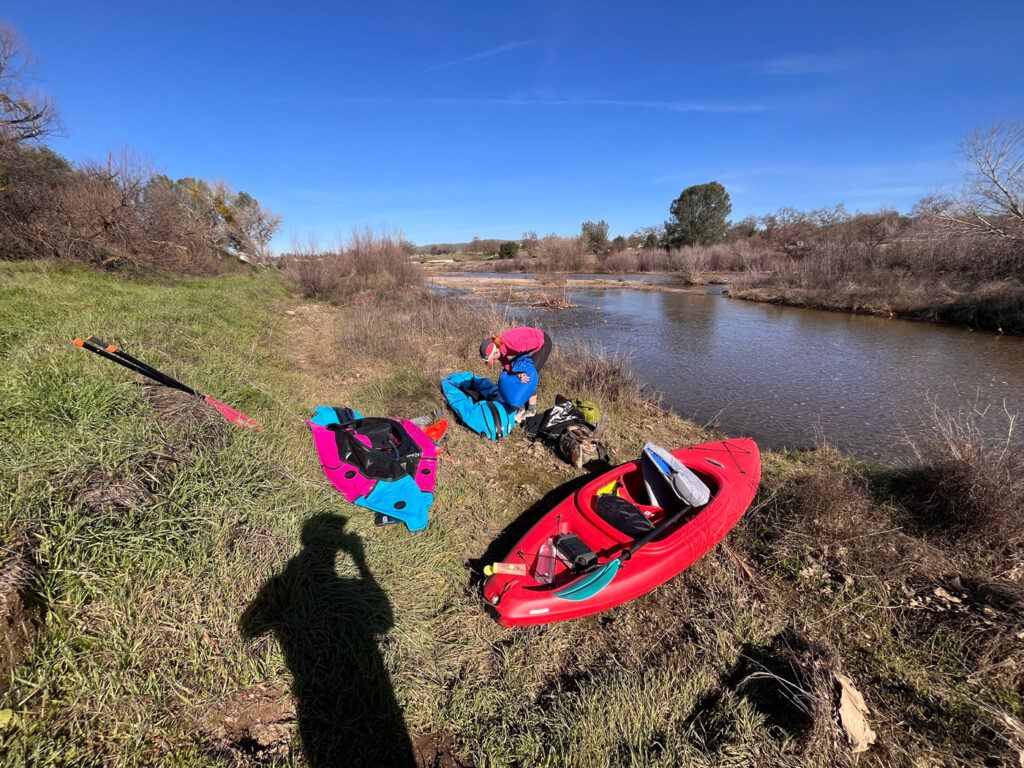 Kayak and packrafts being prepped on the banks of the Salinas River in Atascadero, California.